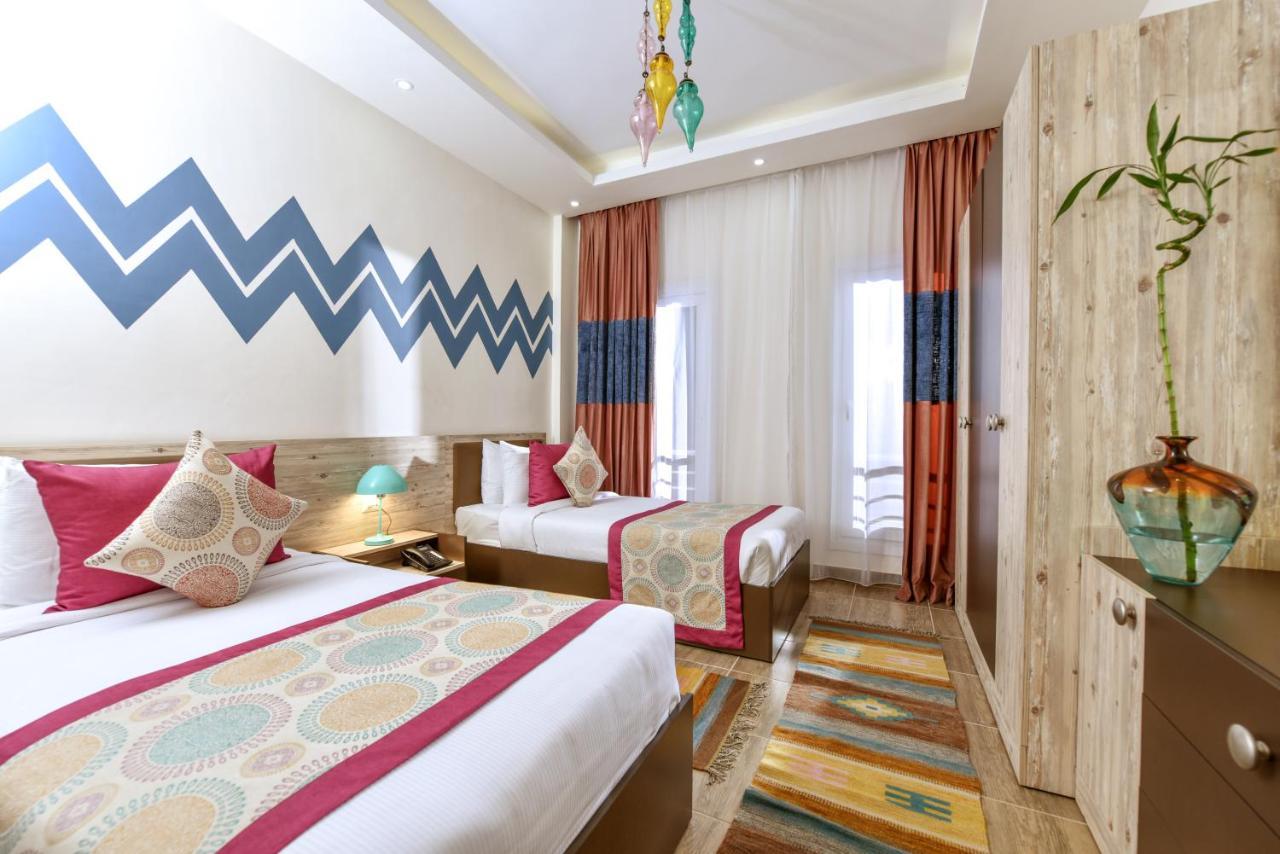 אל עלמיין Tolip North Coast Hotel מראה חיצוני תמונה A room at the hotel