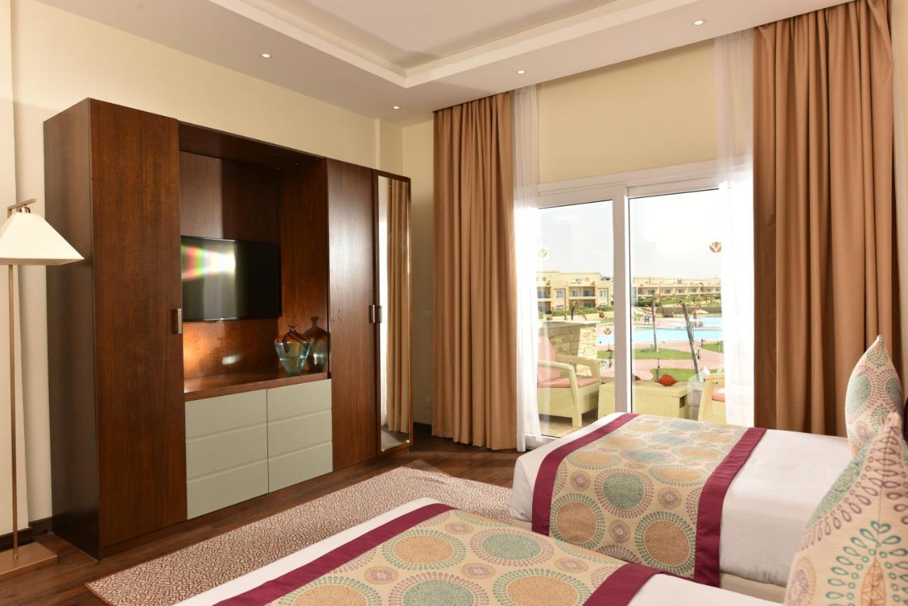אל עלמיין Tolip North Coast Hotel מראה חיצוני תמונה A bedroom at the hotel