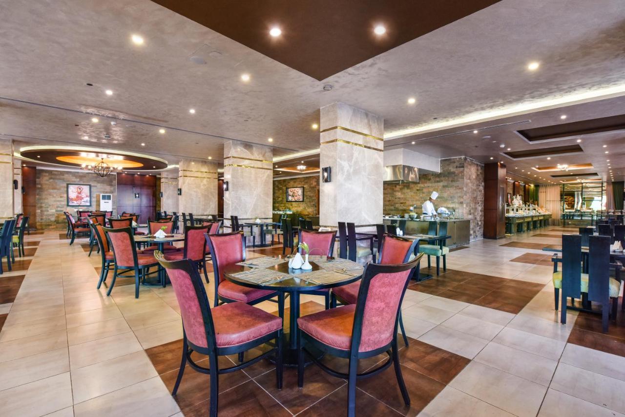 אל עלמיין Tolip North Coast Hotel מראה חיצוני תמונה The restaurant