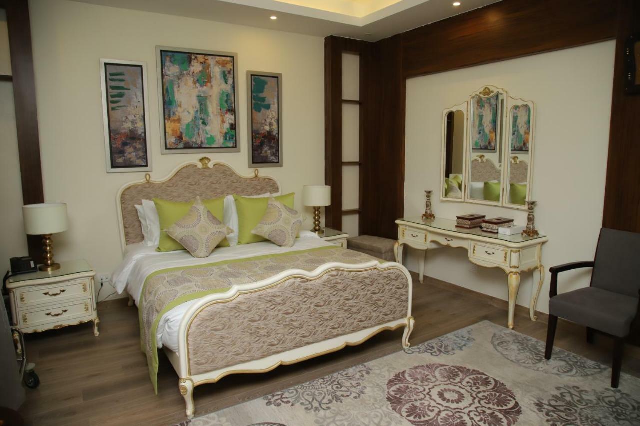 אל עלמיין Tolip North Coast Hotel מראה חיצוני תמונה A bedroom at the hotel
